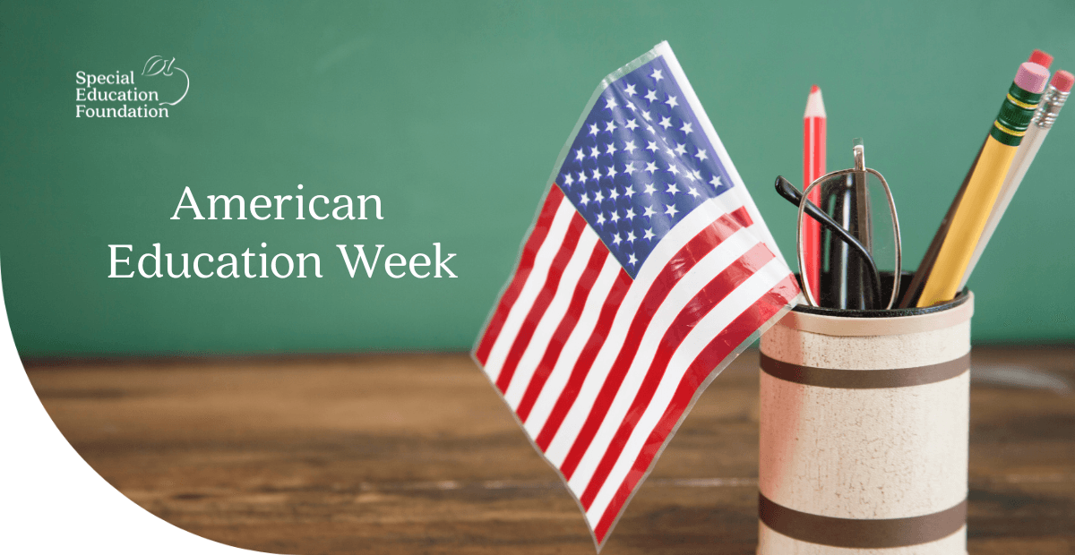 American flag in a cup holder with pencils and glasses 