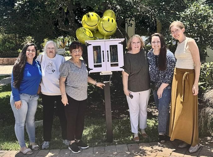 Christ Child Society members with their first little library.