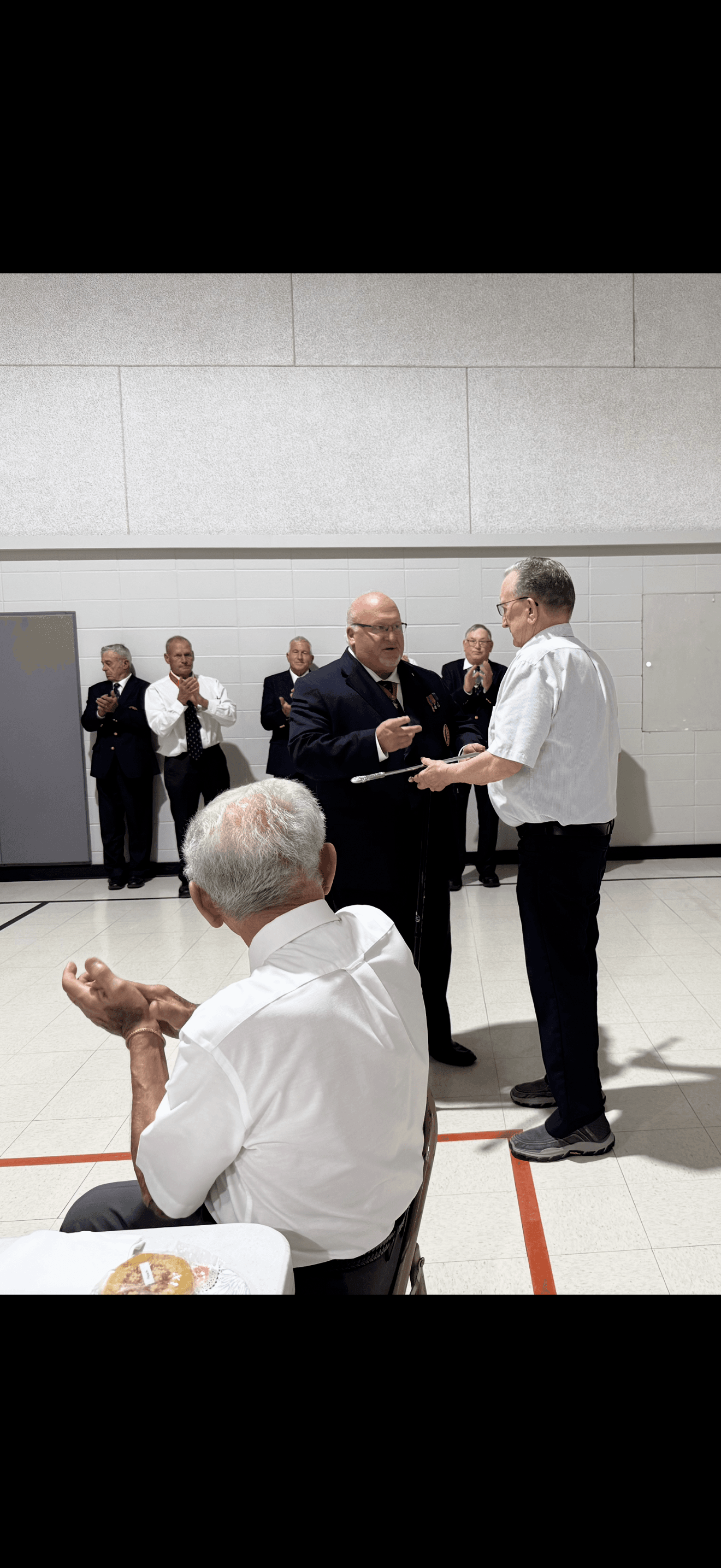 Member receives Sword from District Master
