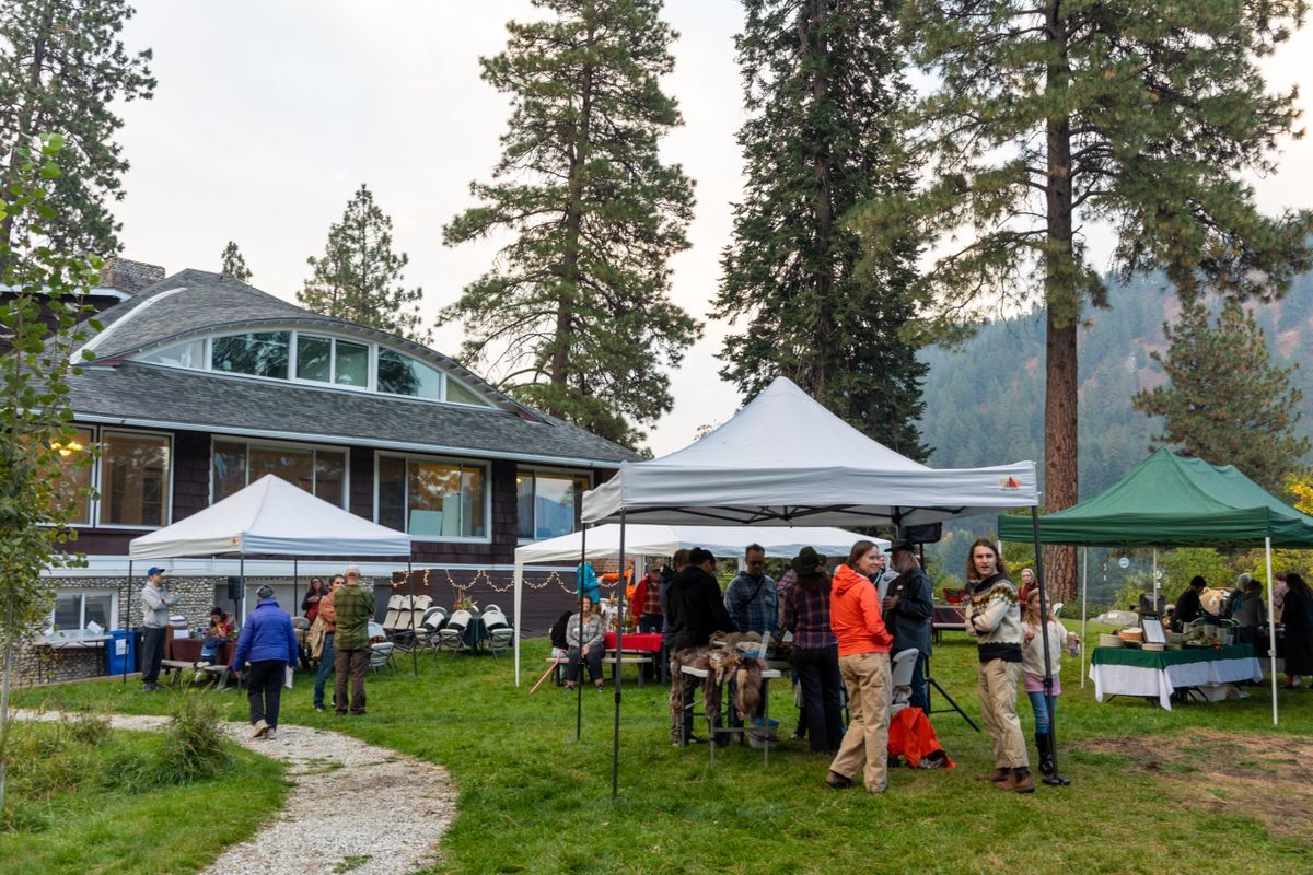 2025 Sunset & S'mores attendees at tables and enjoying the event.