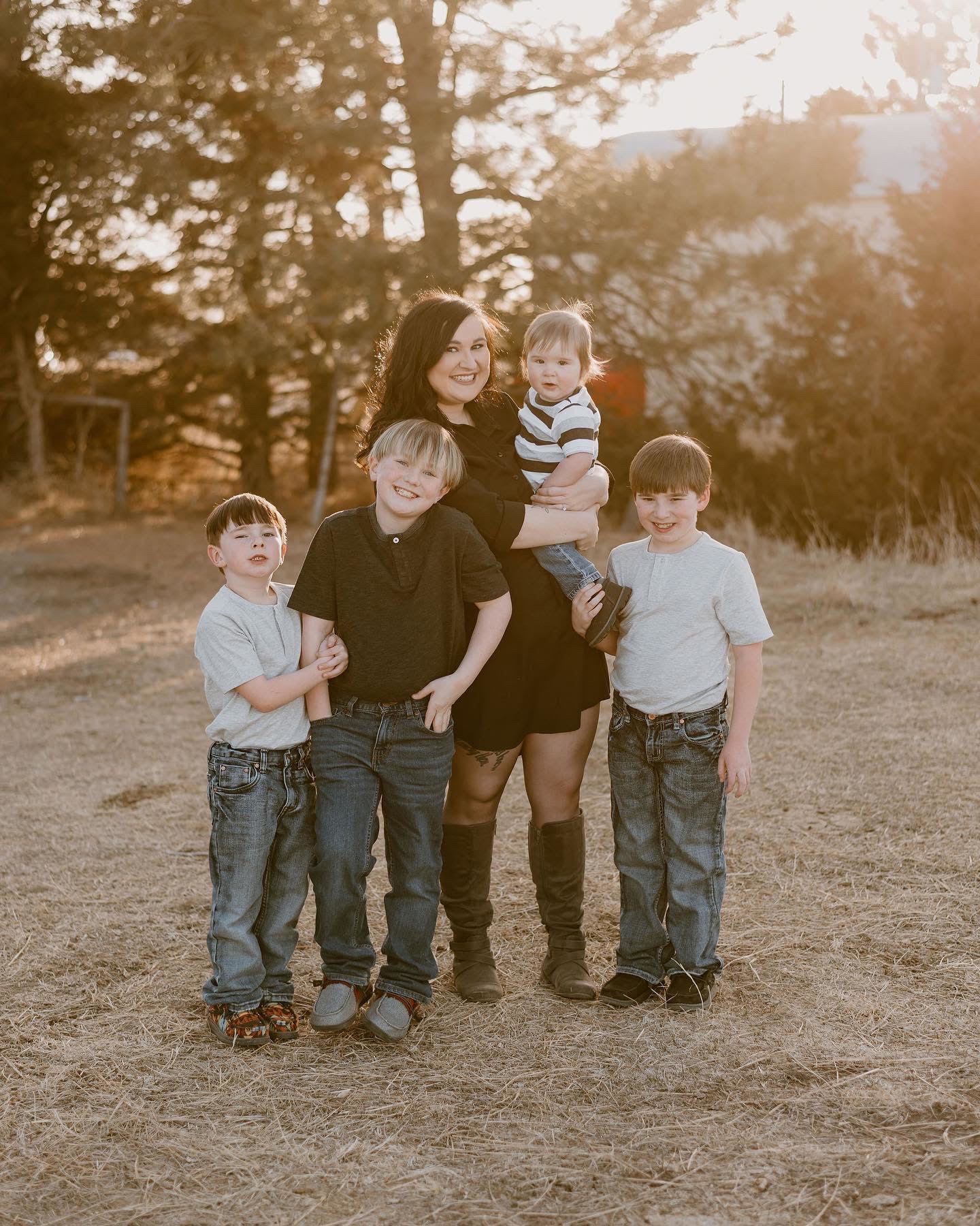 Alexa and her three children posing for a family photo