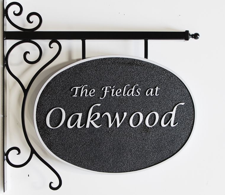 I18101  -  Carved High-Density-Urethane (HDU)  property name sign  made for "The Fields at Oakwood", with Custom Wrought Iron Scroll Bracket  