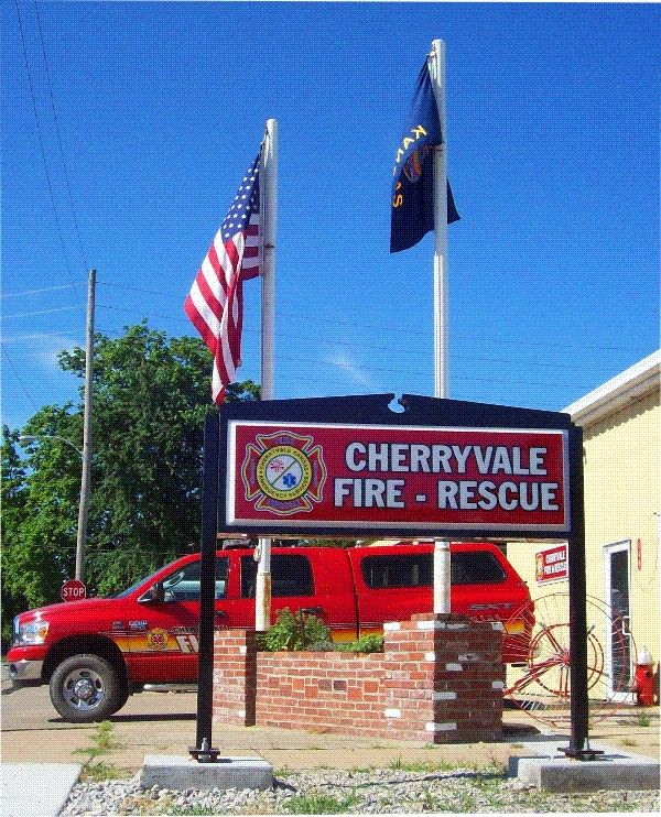QP-1005- Fire Department Badge on Entrance Sign of Cherryvale Fire Rescue Department, Kansas,  Artist Painted