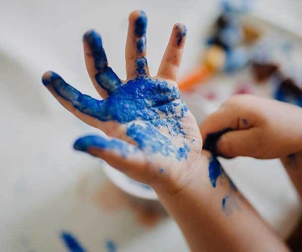 Child's Hands with Blue Paint