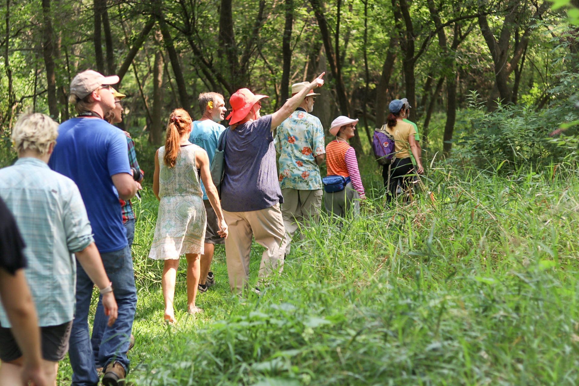 Visitors on a nature walk at Prairie Pines Nature Preserve. 