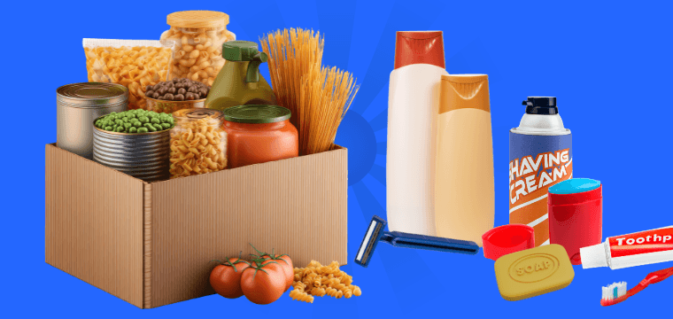 Man in blue shirt stands in front of canned goods in The Caring Place Food Pantry
