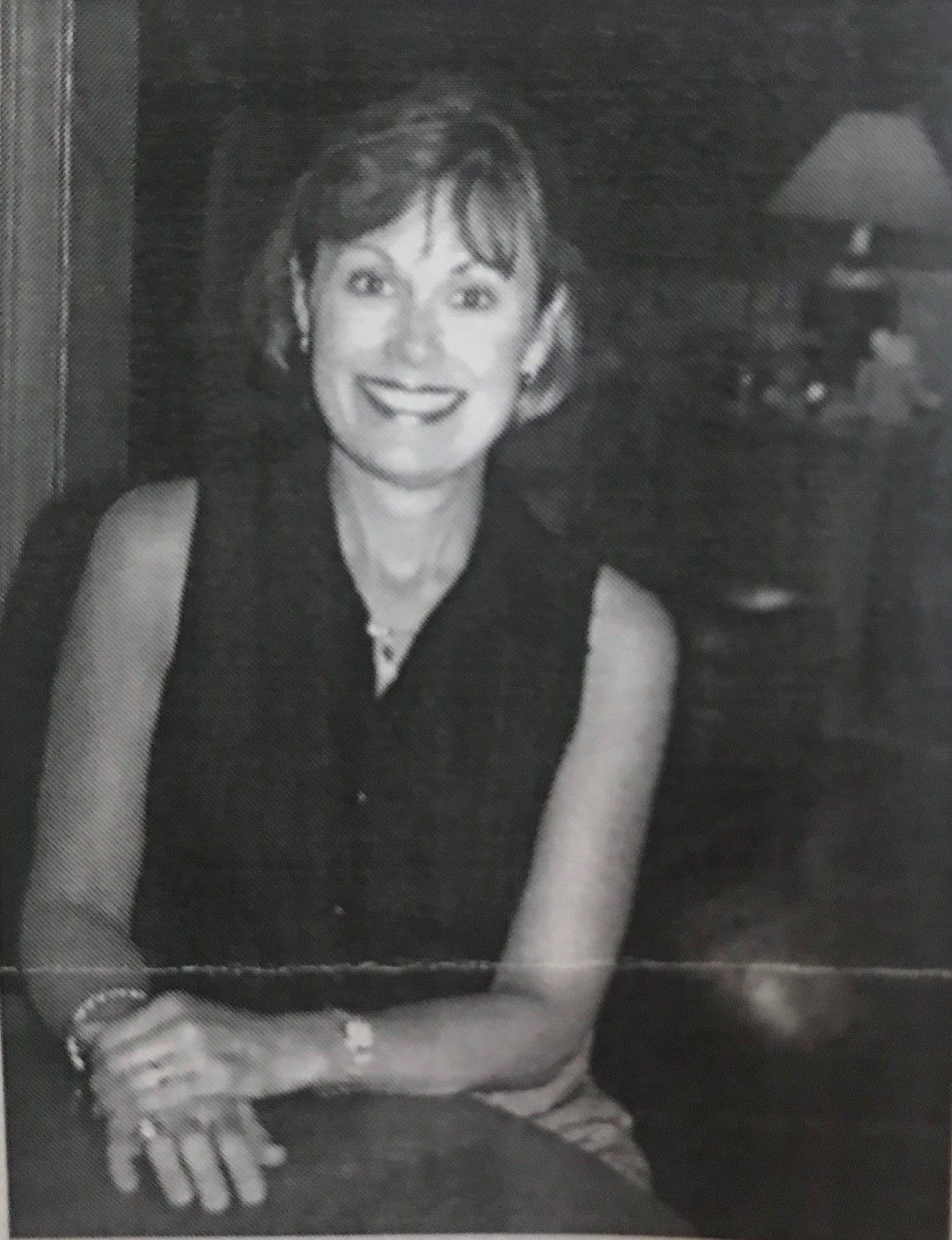 Black and white photo of Jill Evans smiling. 