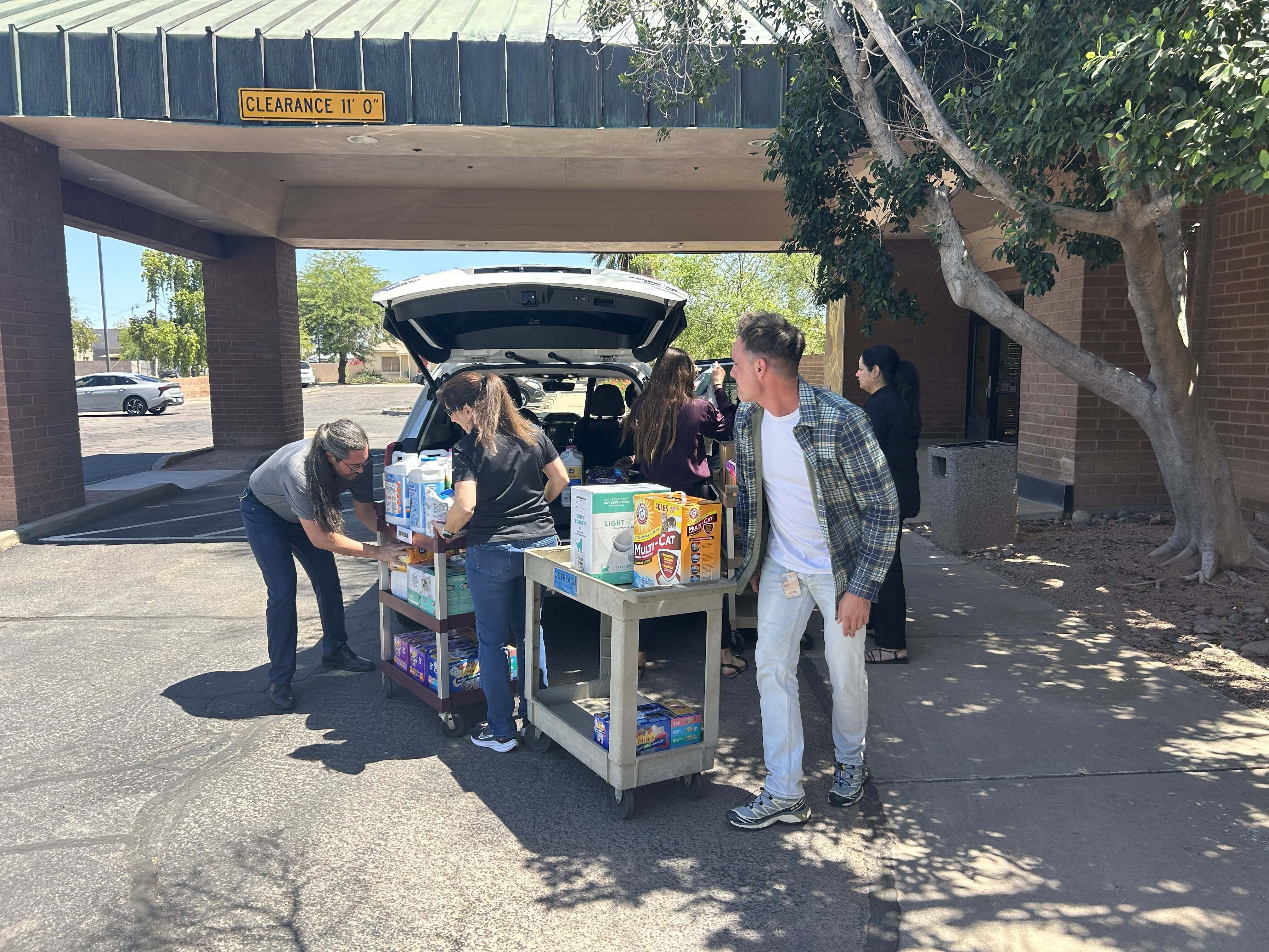 City employees donate 800 lbs. of pet food to seniors