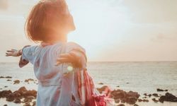 healing sunset someone stretching their arms out