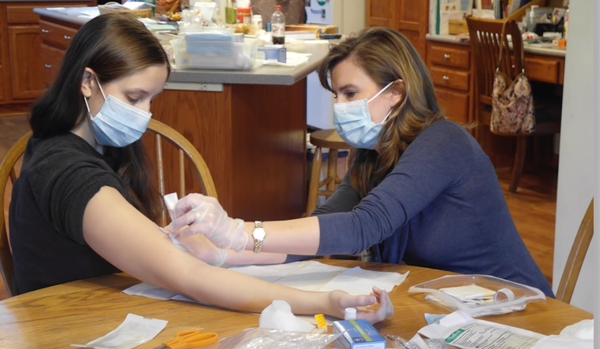 Young PSC patients often go through lots of medical treatments. In this photo, a teenage PSC patient is getting her blood drawn at home by a visiting nurse.