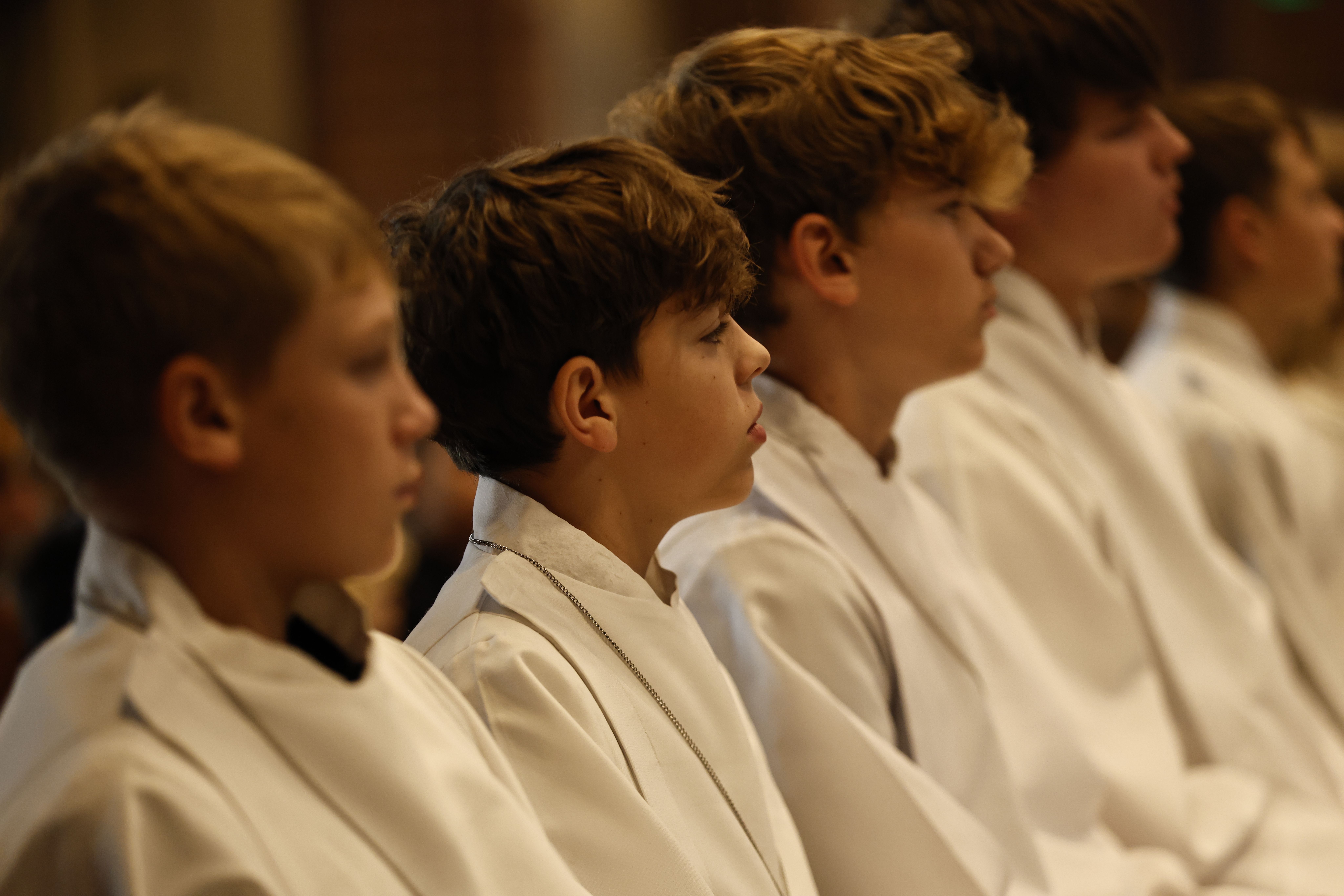 Students and families worshiping together at Mass