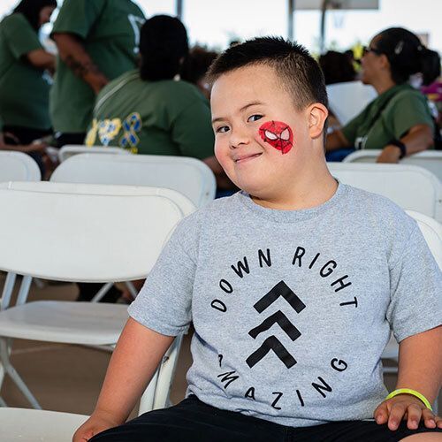 Child with Spiderman facepaint.