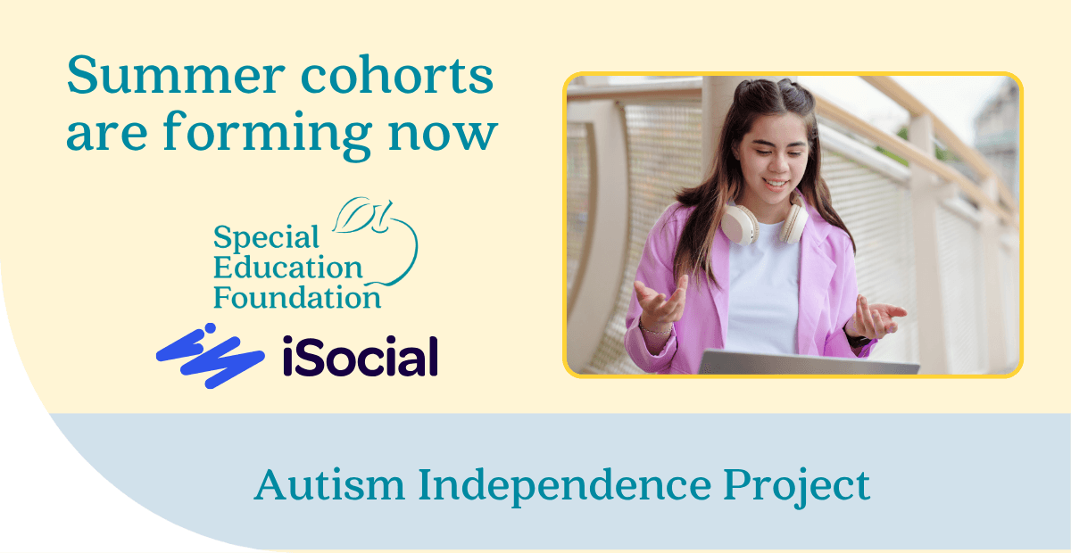 girl with headphones around her neck looking at a laptop