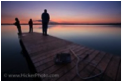 This is a picture of the sunset off a dock