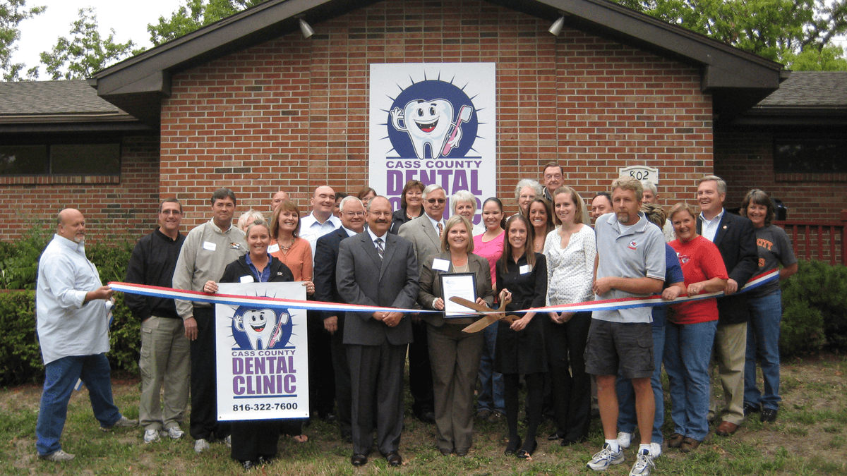 group of people at ribbon cutting