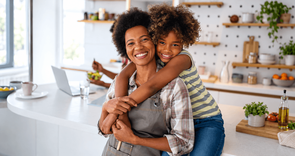 Man holding son laughing