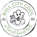 Logo for the Bull City Cool Food Hub, which is round and appears to have been stamped with lines of varying consistency and thickness. There are two black circles, one within the other, and between them in an arc at the topi is "Bull City Cool" in light g