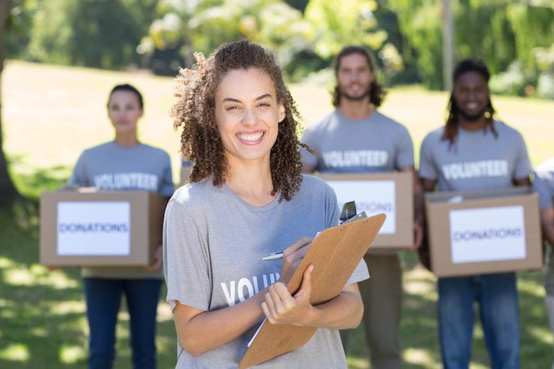 Volunteers holding boxes