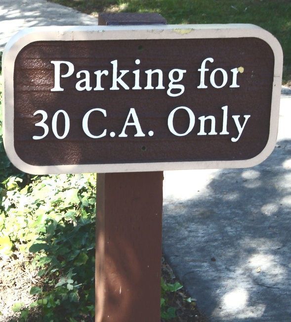 M4726 - Redwood  4"x4" Wood Post Supporting a Cedar Parking Sign. 