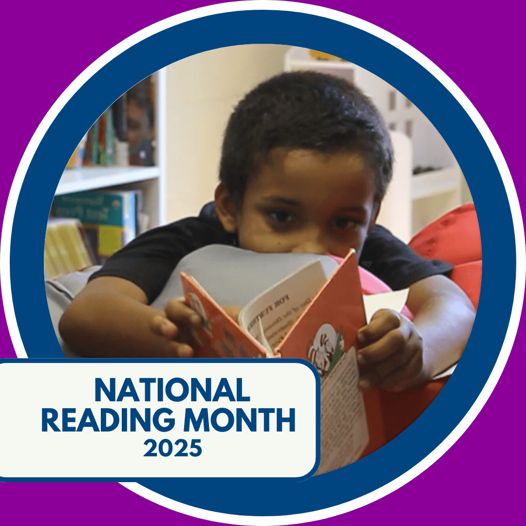 Circular image with orange border of a child reading a book while laying on a bean bag chair