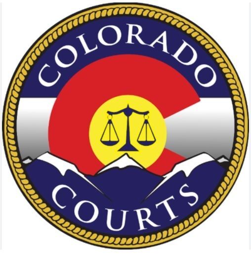 Scales of justice and Colorado courts motif with backdrop of Colorado state flag