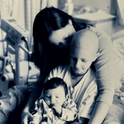 Co-Founder, Beecher Grogan, holds her two children in the hospital.