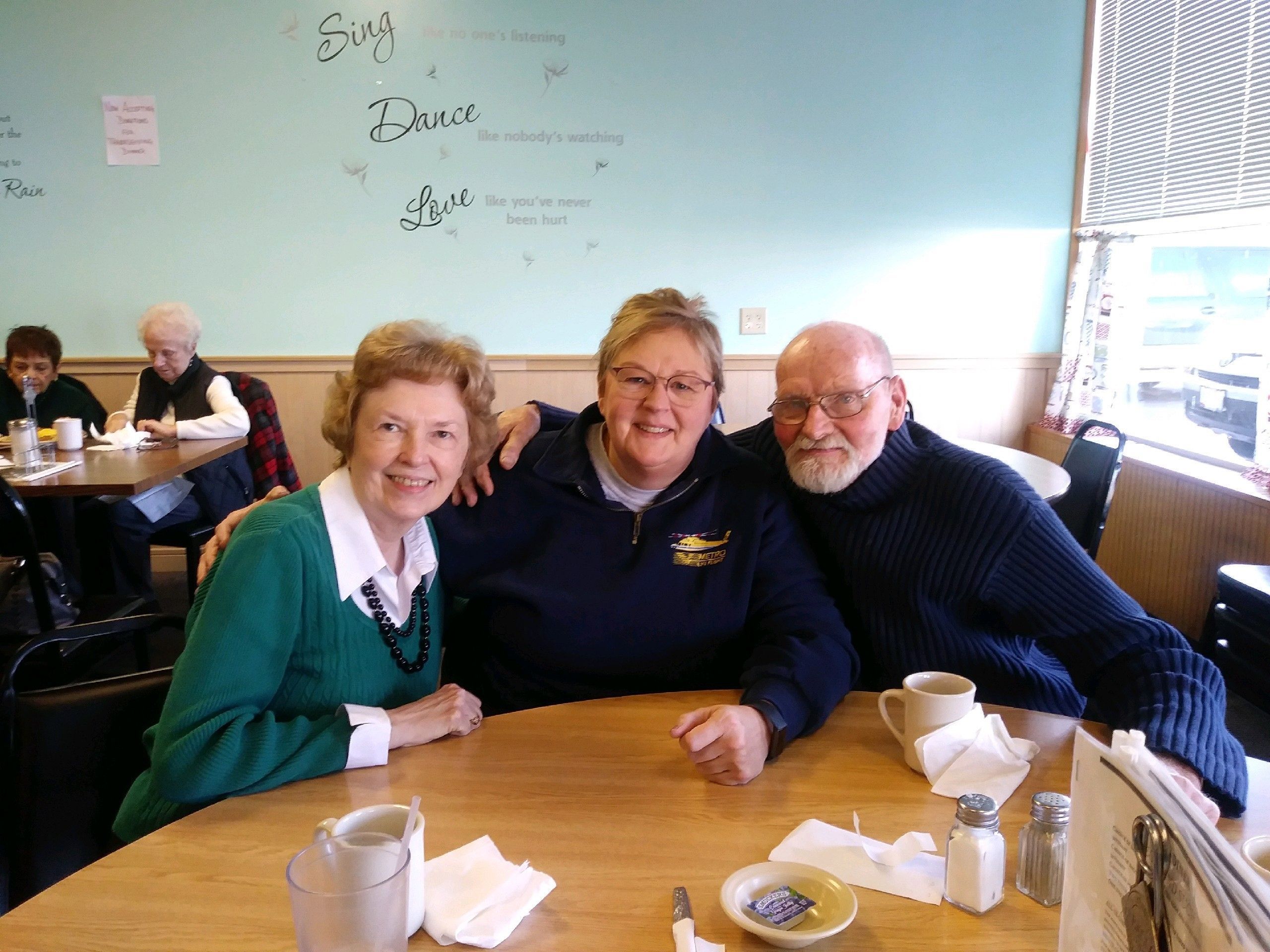 Karen (center) pictured with her sister Carol and her brother Ed.