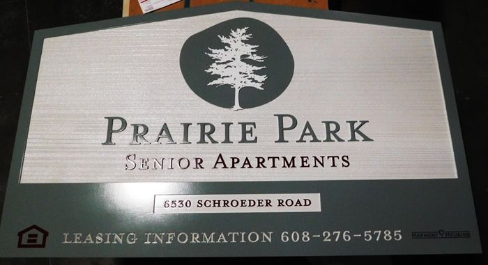 K20339 - Carved HDU Entrance Sign,  for the "Prairie Park" Apartment with Wood Grain Sandblasted Background