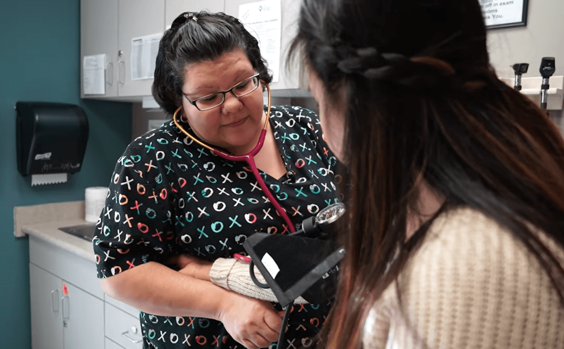 A patient receiving medical care at a Bluestem clinic