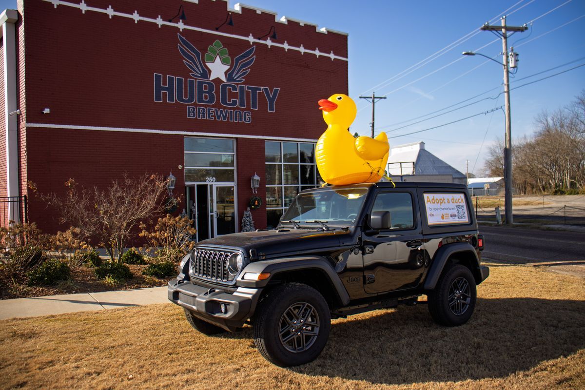Jeep with an inflatable duck on top