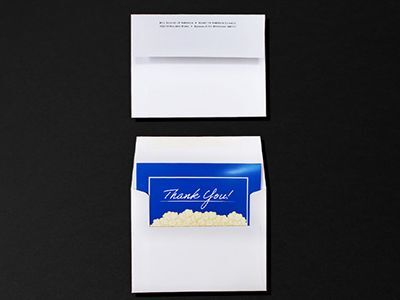 Custom printed thank you card with matching envelope.