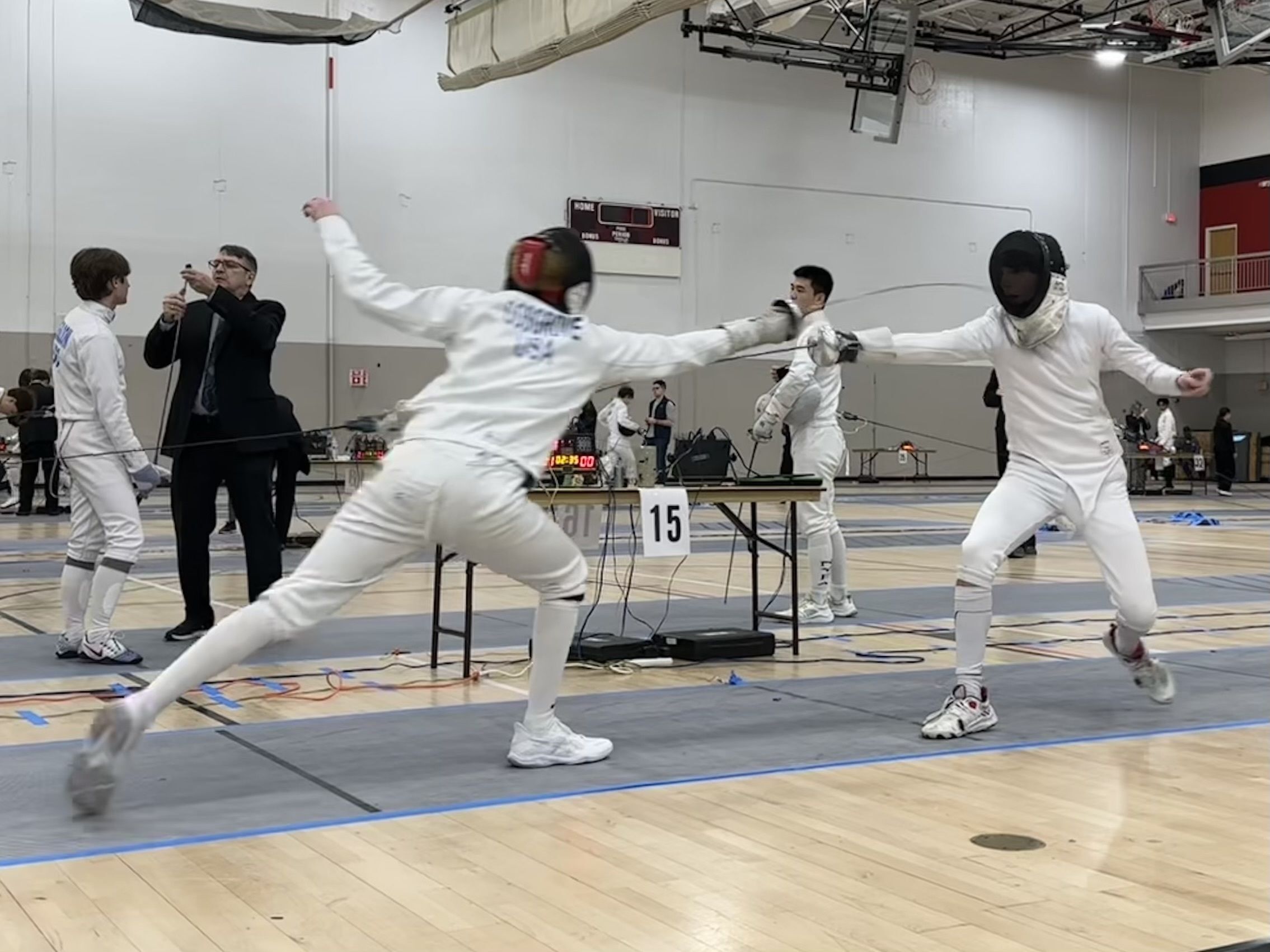 An epee fencer fleches at his opponent