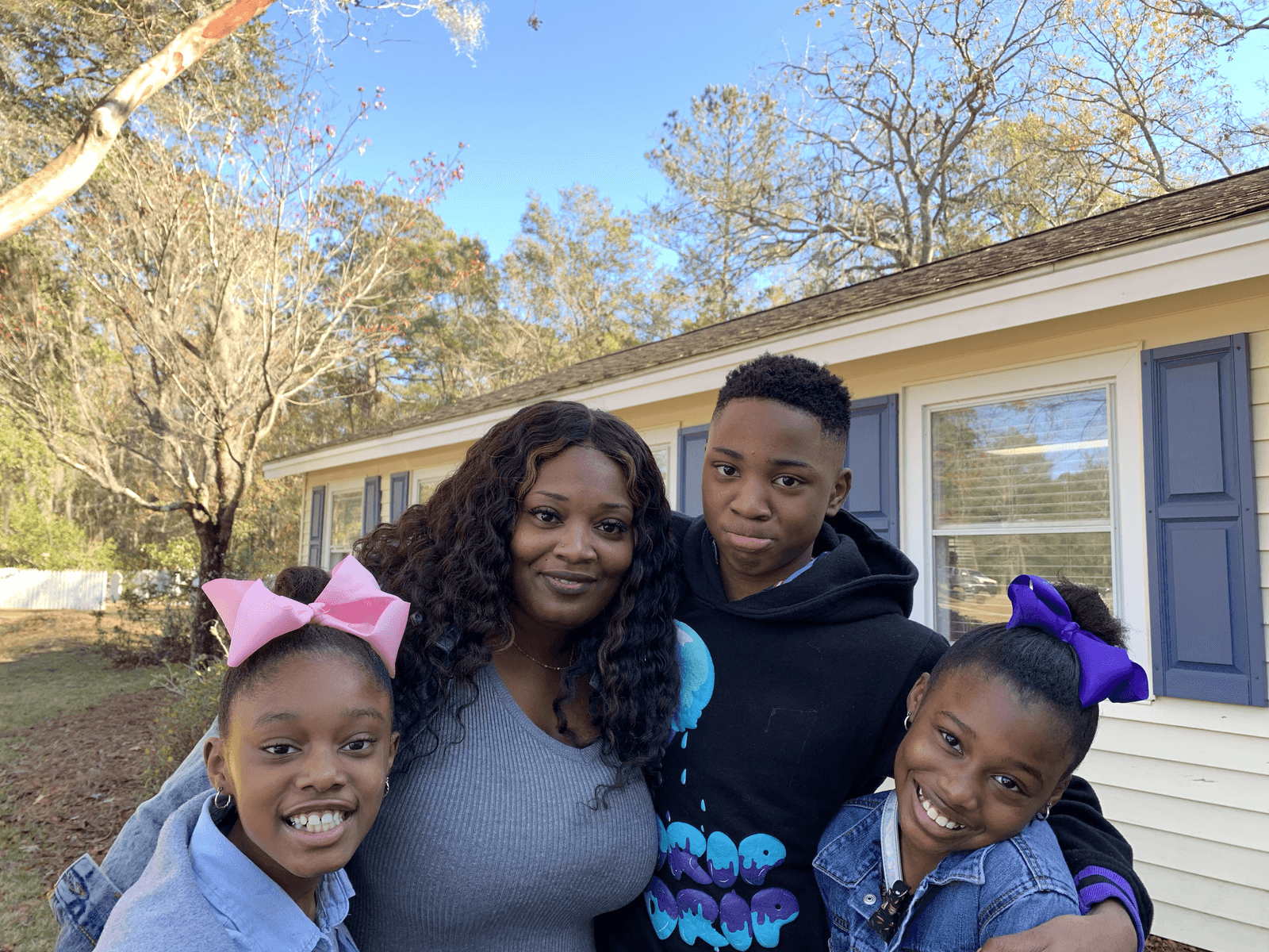 Woman with son and two daughters