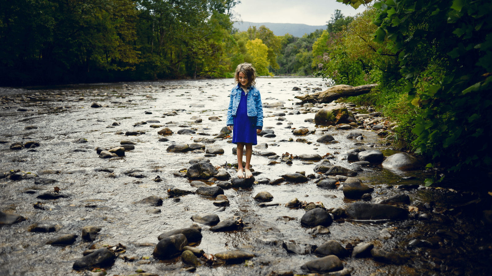 Child playing in river