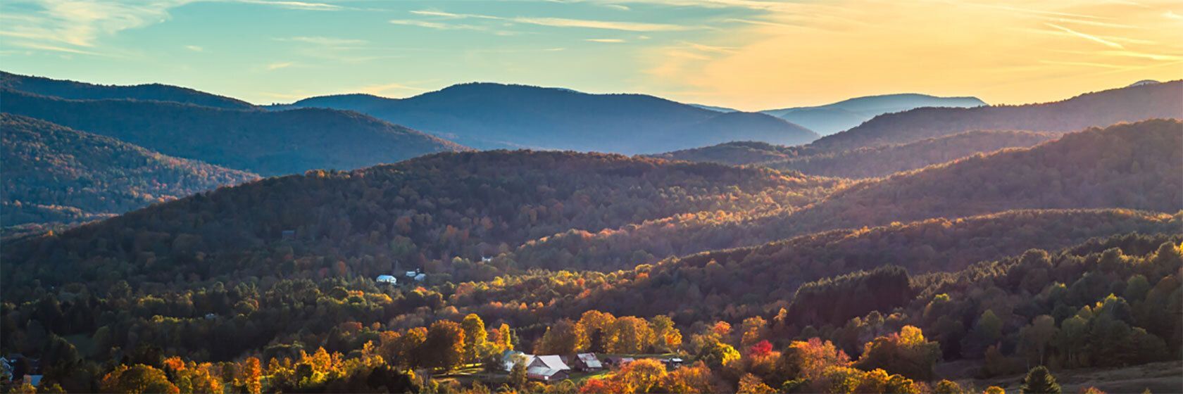 Sunrise over hilly mountains.