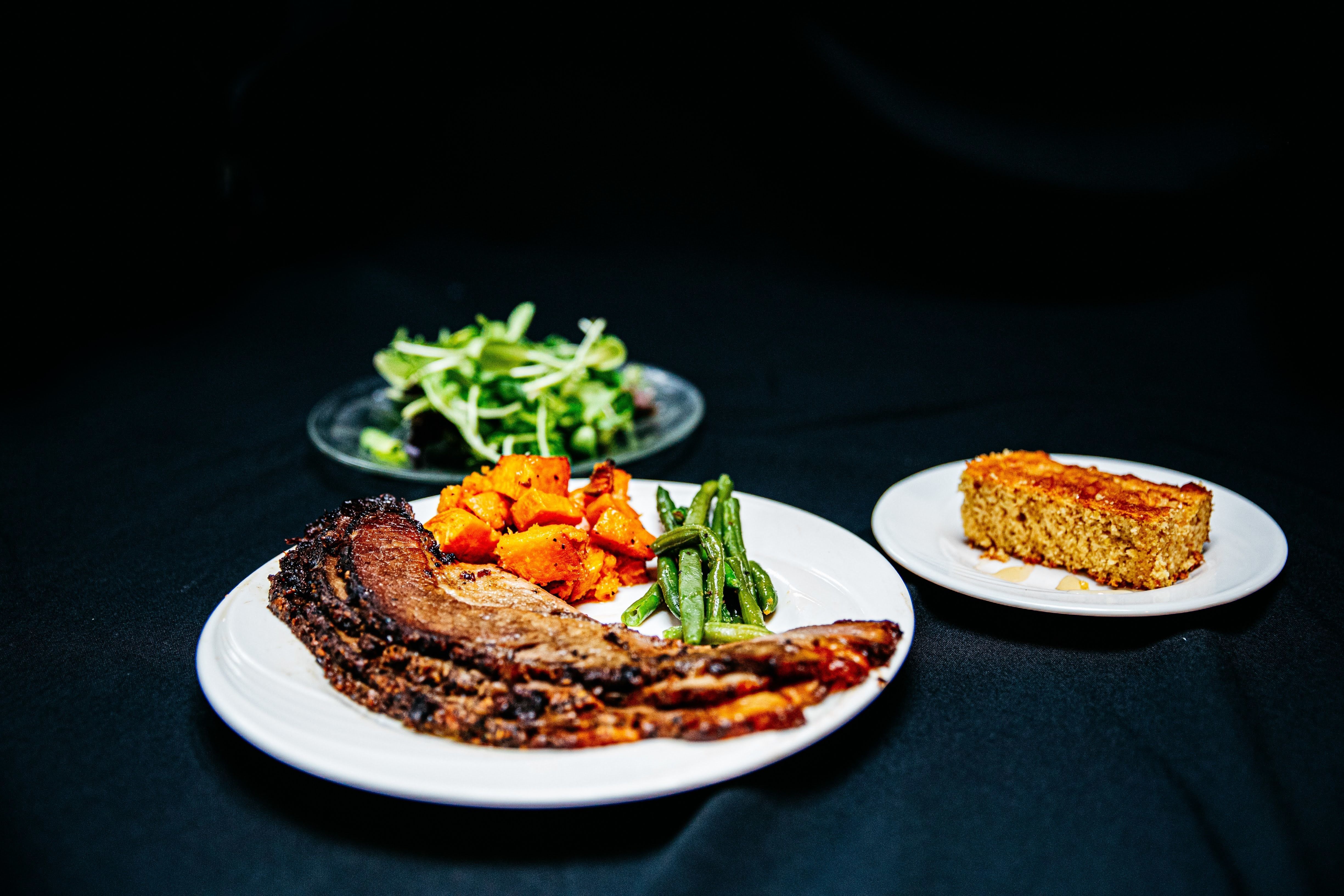 Grassfed smoked brisket, diced sweet potatoes, green beans, mixed micro green salad mix, sweetcorn cornbread with honey.