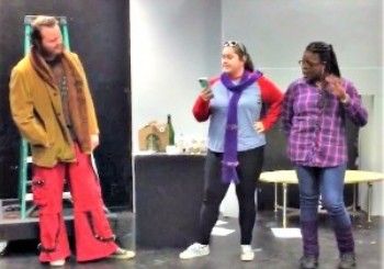 Three students performing in theater class