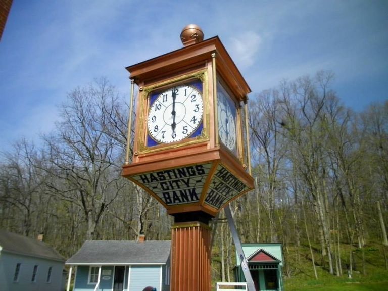 Trailhead with map and trail extending into distance. 