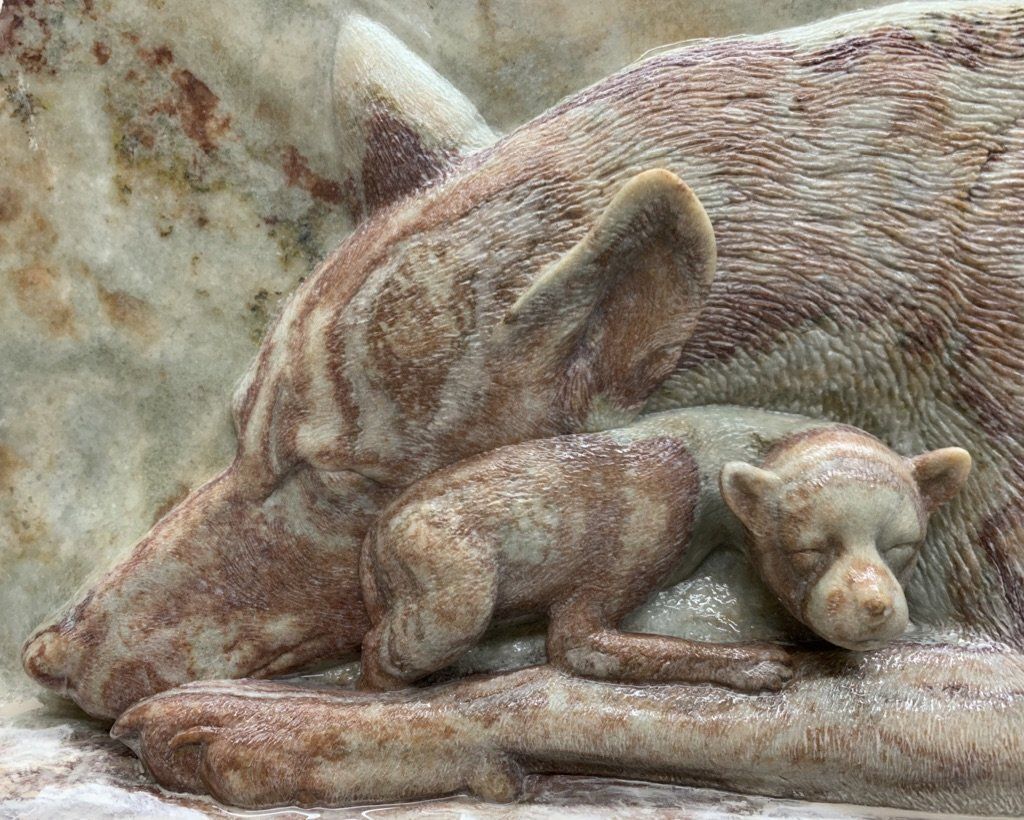 Final carving shows the mother and puppy
