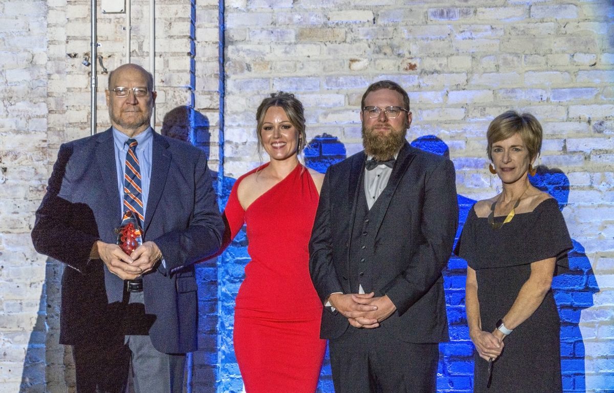Mark Randolph accepting the Paul H. Levy Founders Award posthumously for his wife Mona Randolph with Gala Co-Chairs Jennifer Salva, Logan Weed, and The Whole Person’s CEO Julie DeJean