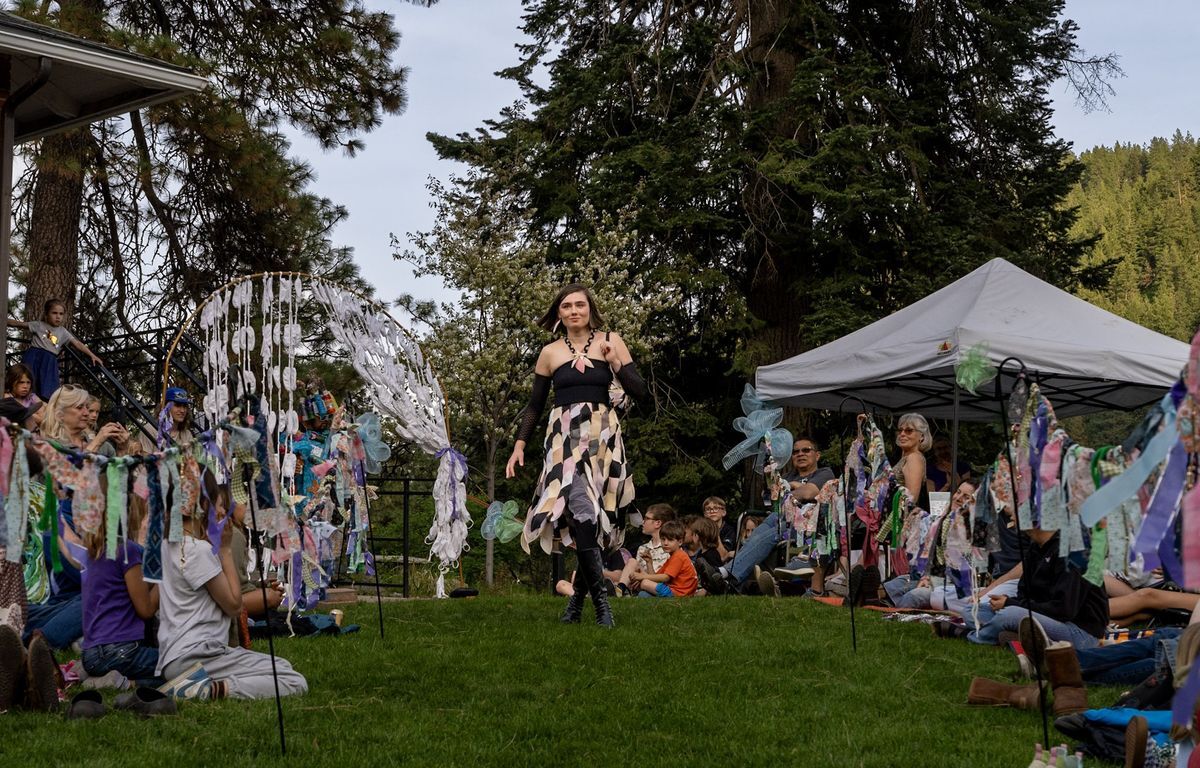 A photo of a Trashion Show participant strutting the runway in her outfit.
