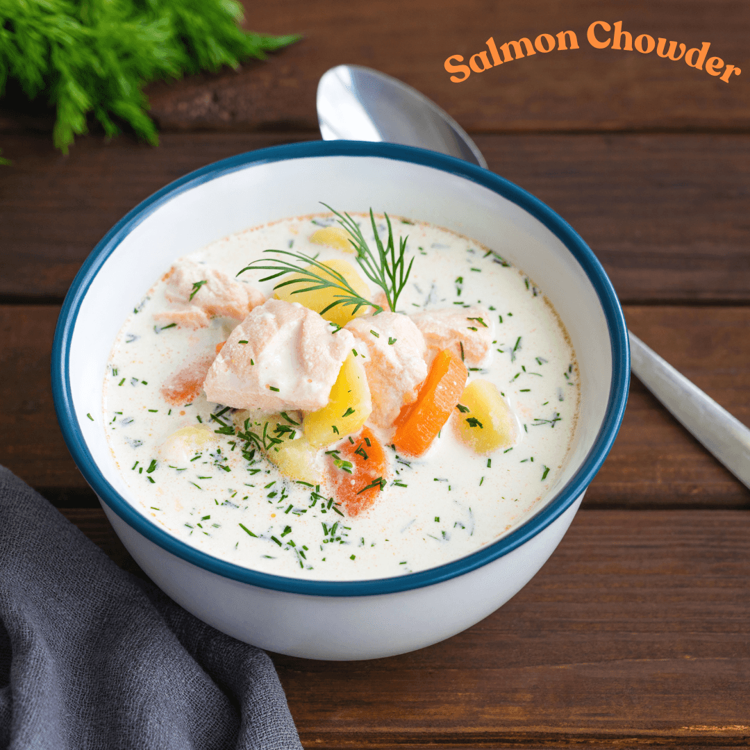 Bowl of salmon chowder with herbs