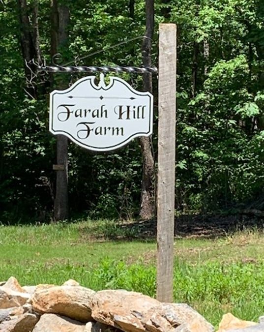 O24026 - Engraved HDU Sign for the Farah Hill Farm, Hung from Wrought Oron Scroll Bracket Mounted  on a Wood Post 