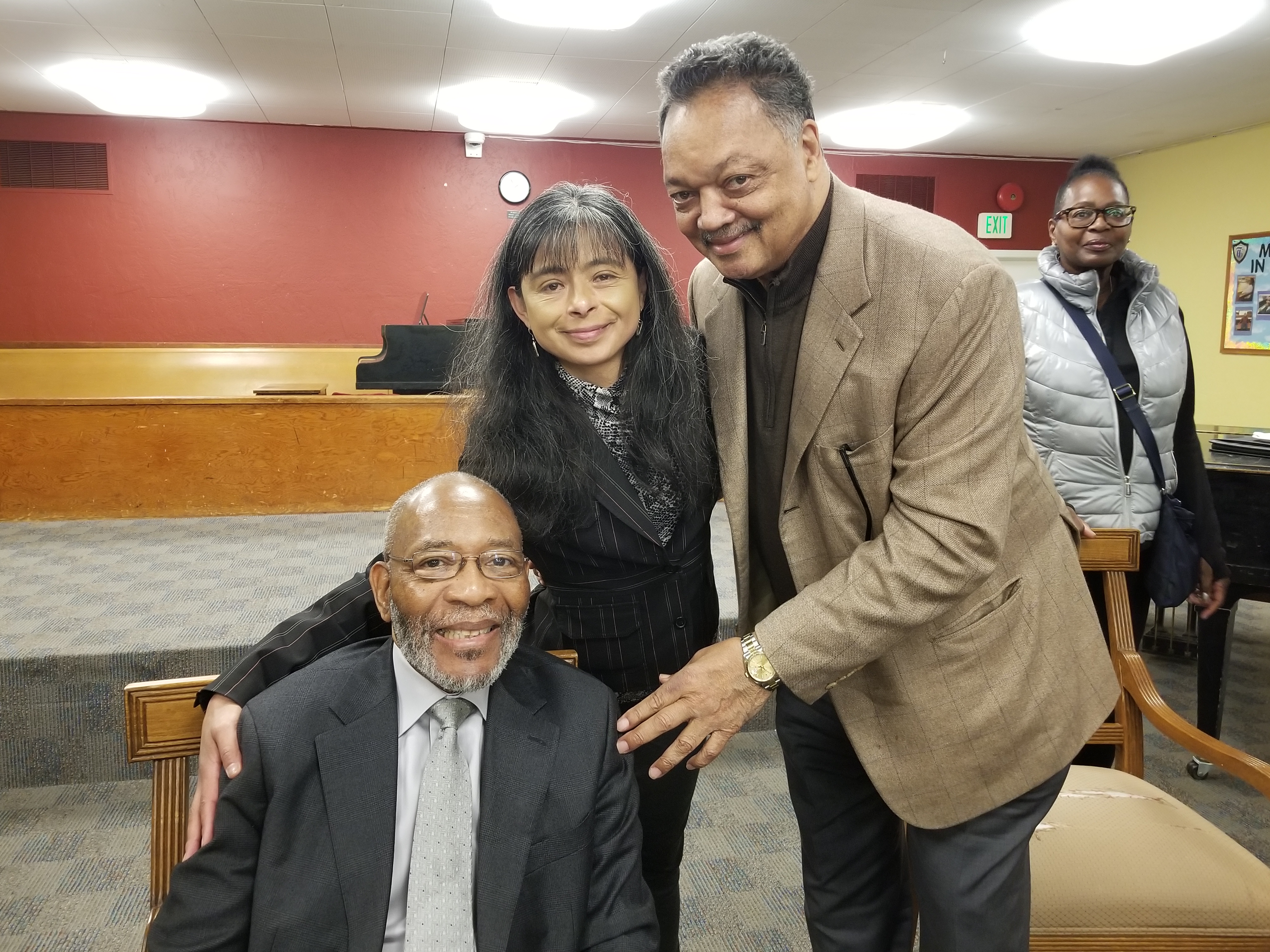 Catholic Charities CEO Jilma Meneses, Rev. Dr. Amos Brown & Rev. Dr. Jesse Jackson stand with the Muslim community