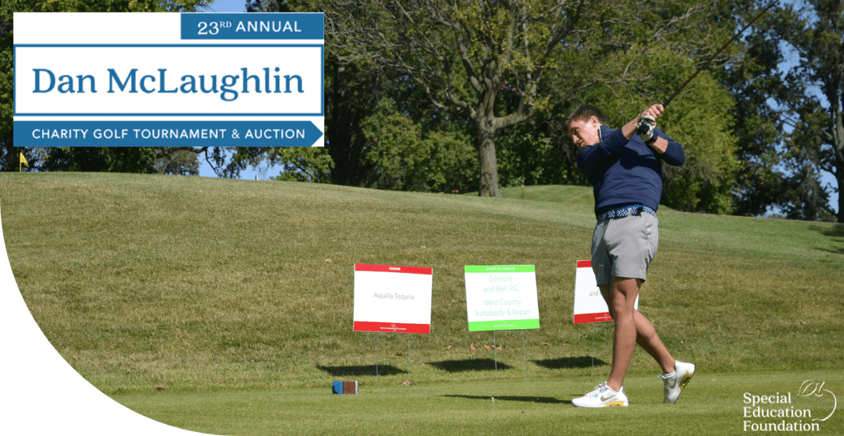 man swinging a golf club on a course