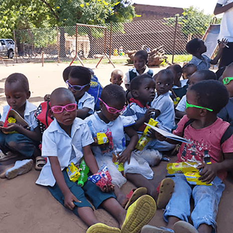 Kids sitting and enjoying treats