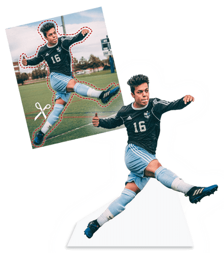 Soccer player shooting the ball, cut out from background