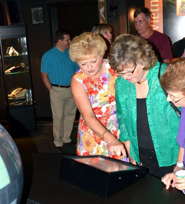 Guests interact with the Magic Planet