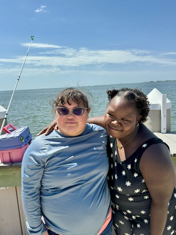 Fabiola and Lavette smiling and spending time outdoors at Tuckerton Green Street on a sunny day.