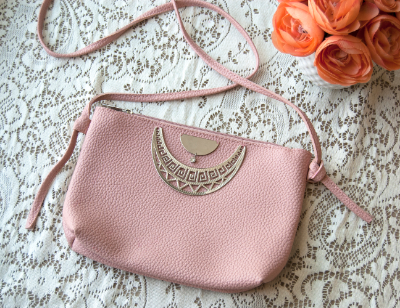 Add jewelry pieces to a thrifted clutch from Goodwill to make it your own.